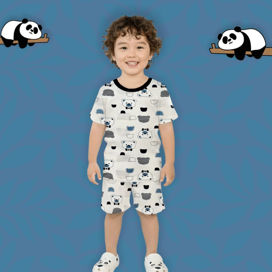 Child wearing a panda-themed outfit on a blue background with cartoon pandas.