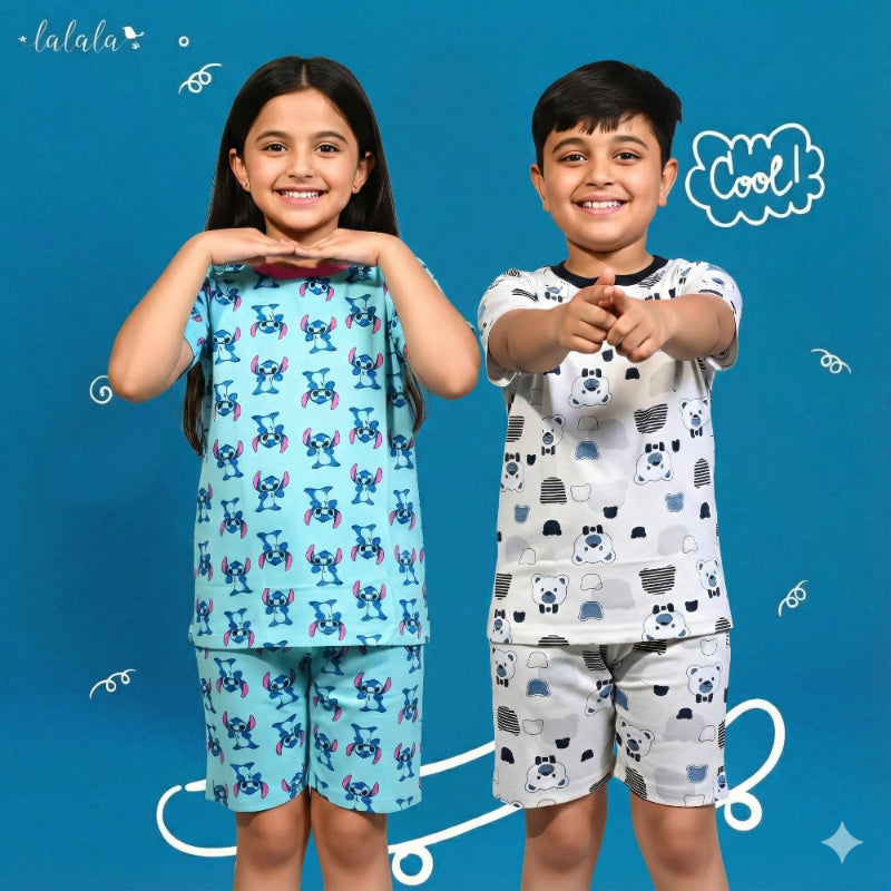 Two children wearing pajama sets with a blue background and 'lalala' branding.
