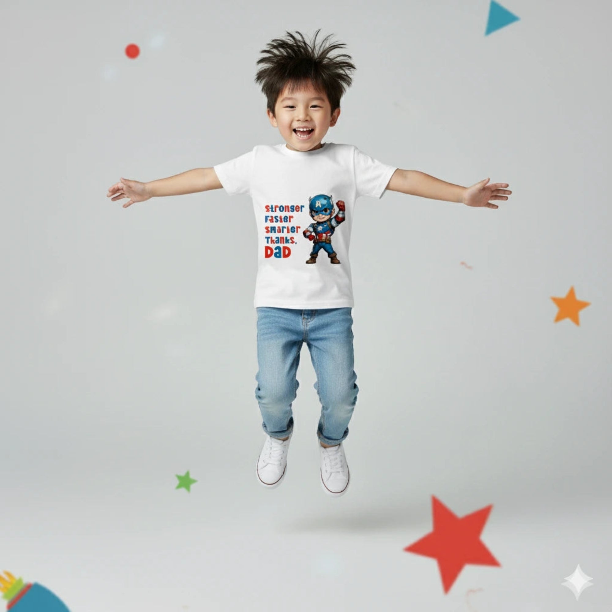 Child wearing a white t-shirt with a superhero graphic and text, standing against a light gray background with colorful stars.