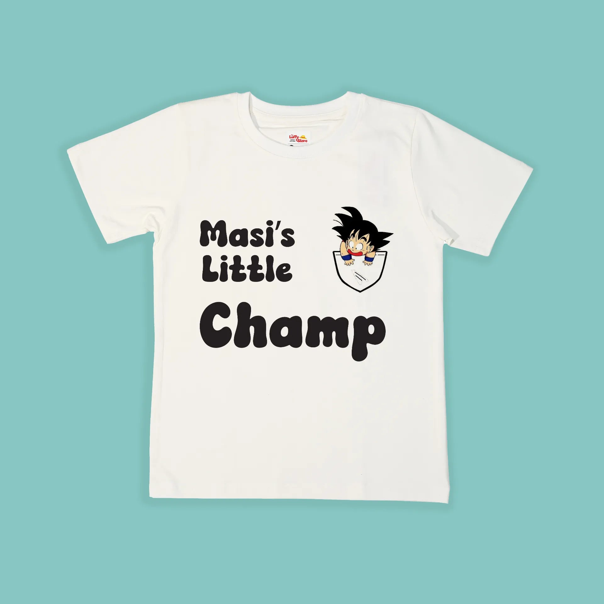 White t-shirt with 'Masi's Little Champ' text and cartoon character on a light blue background