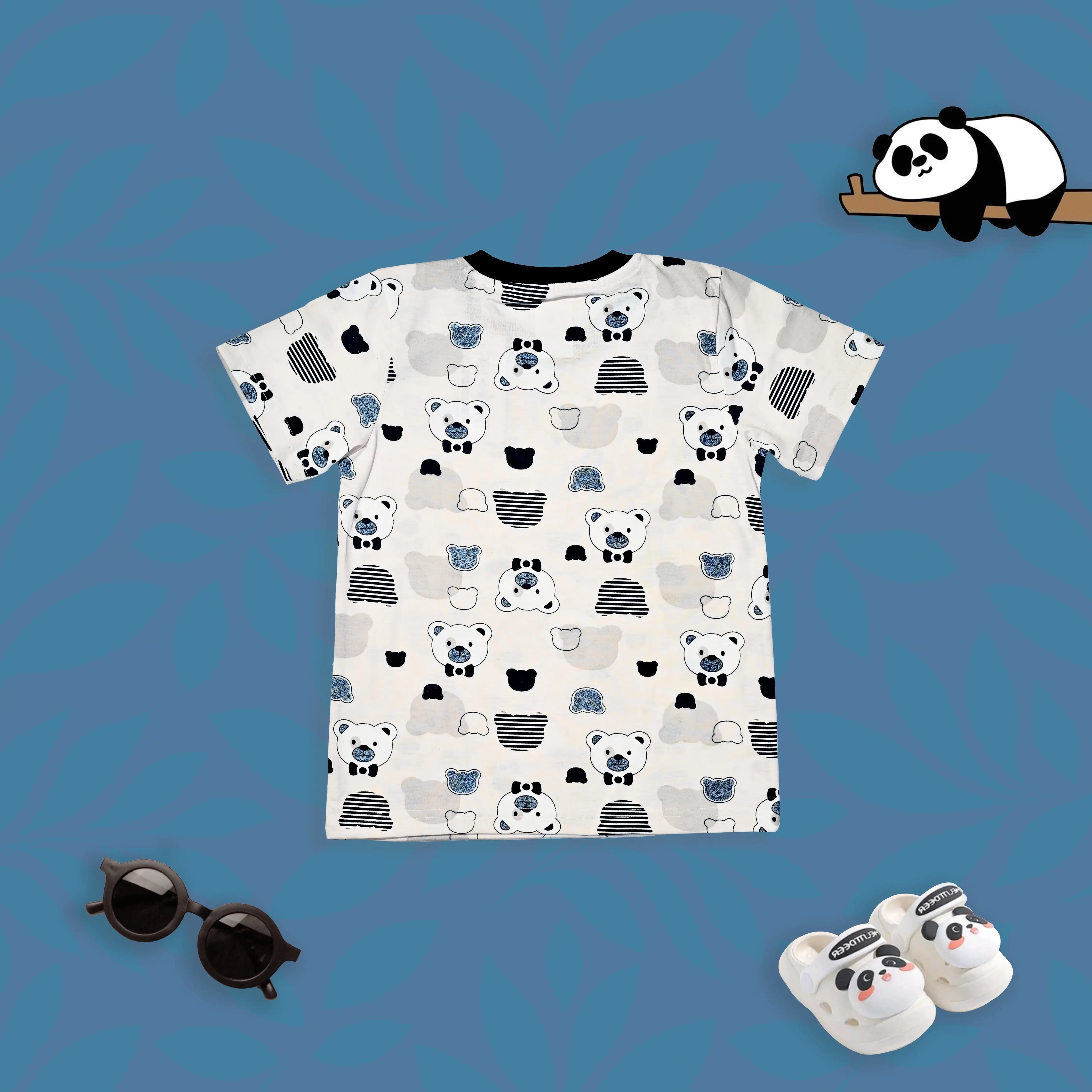 Children's t-shirt with panda pattern, sunglasses, and slippers on a blue background