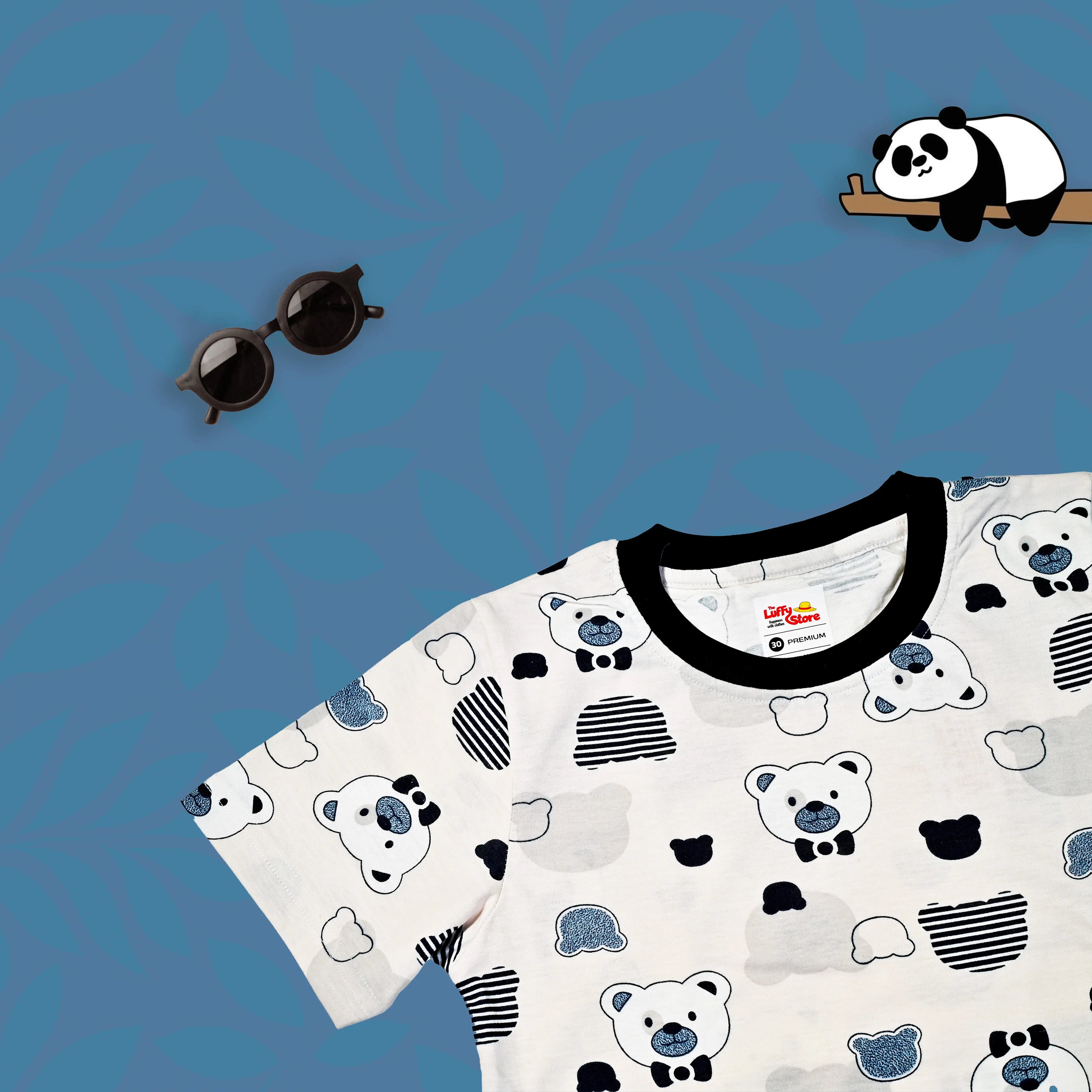 White t-shirt with bear pattern, sunglasses, and panda on a blue background