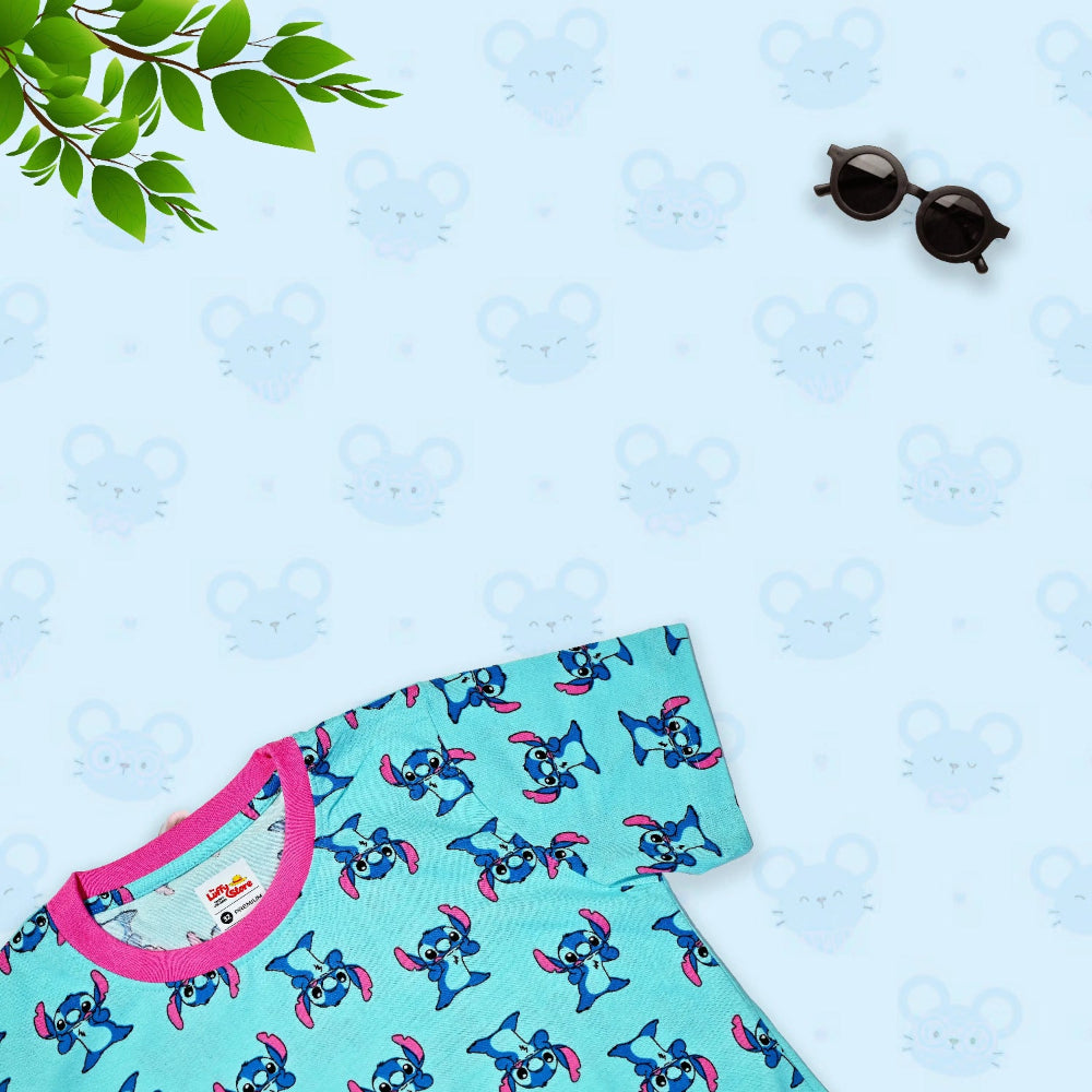 Children's dress with cartoon character pattern on a light blue textured background
